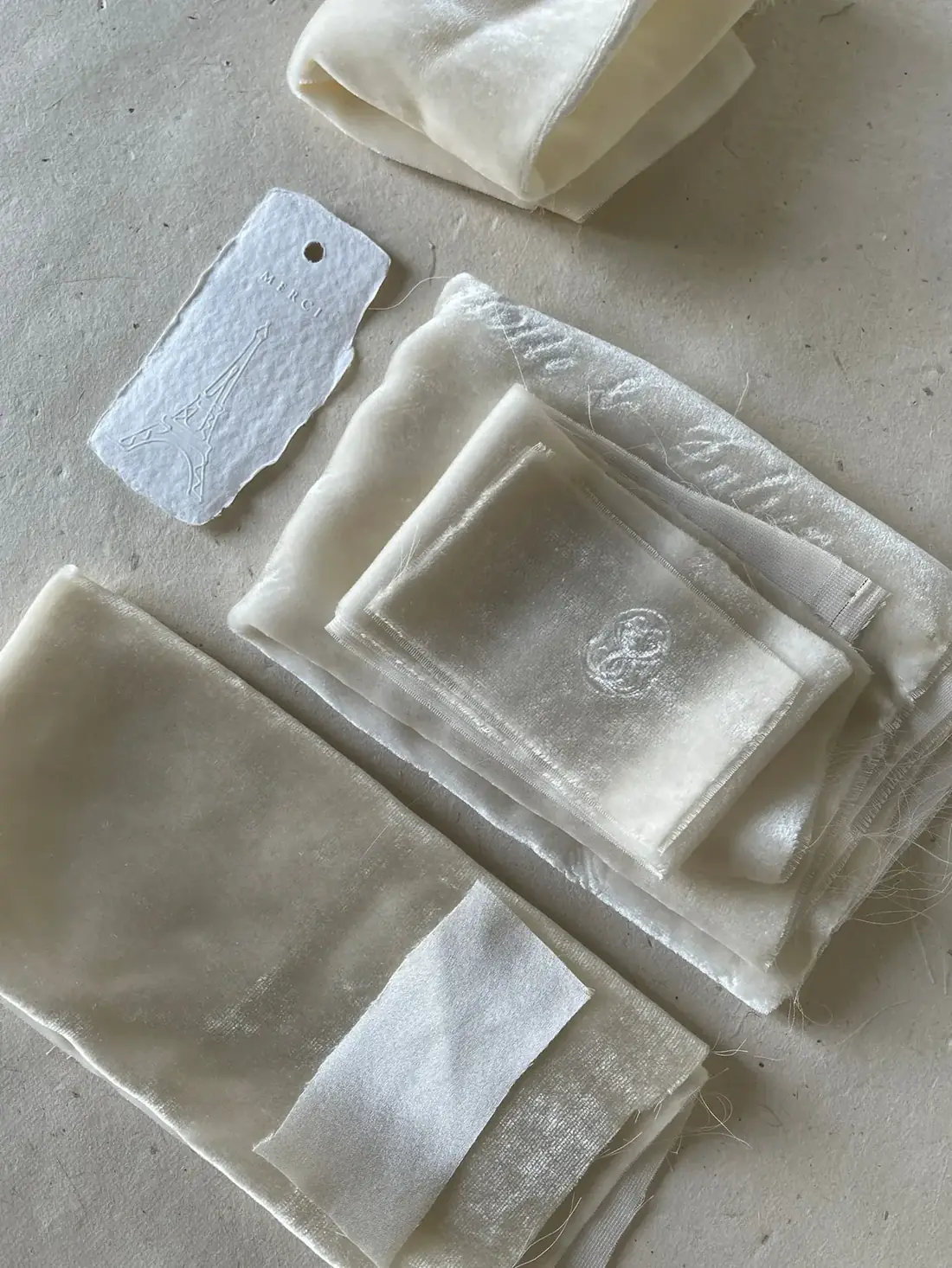 Neutral fabric swatches showing different textile textures