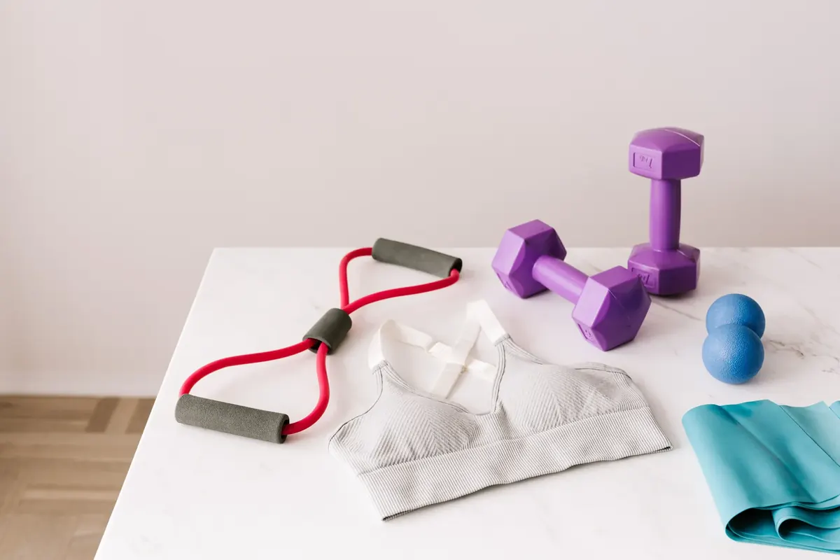 Sports bra arranged with workout equipment for activity-based selection