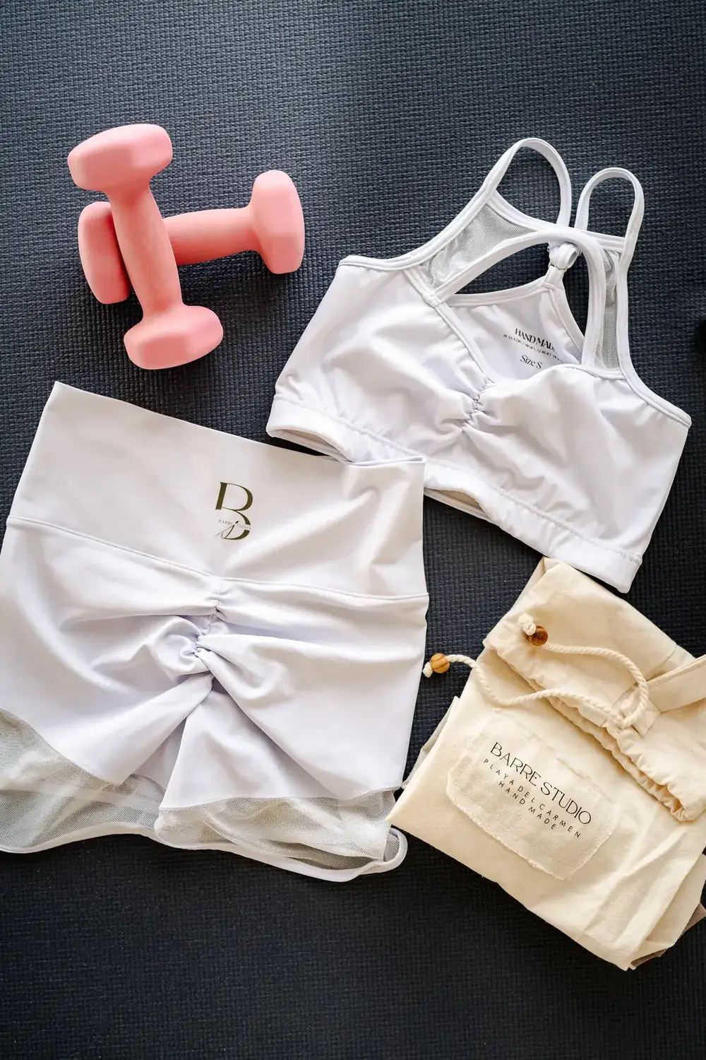 Sports bra and workout gear arranged as an activity flat lay