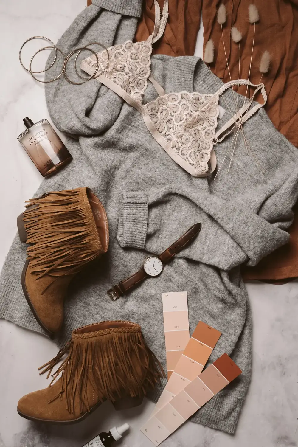 Soft bra styled with neutral clothing in an editorial flat lay