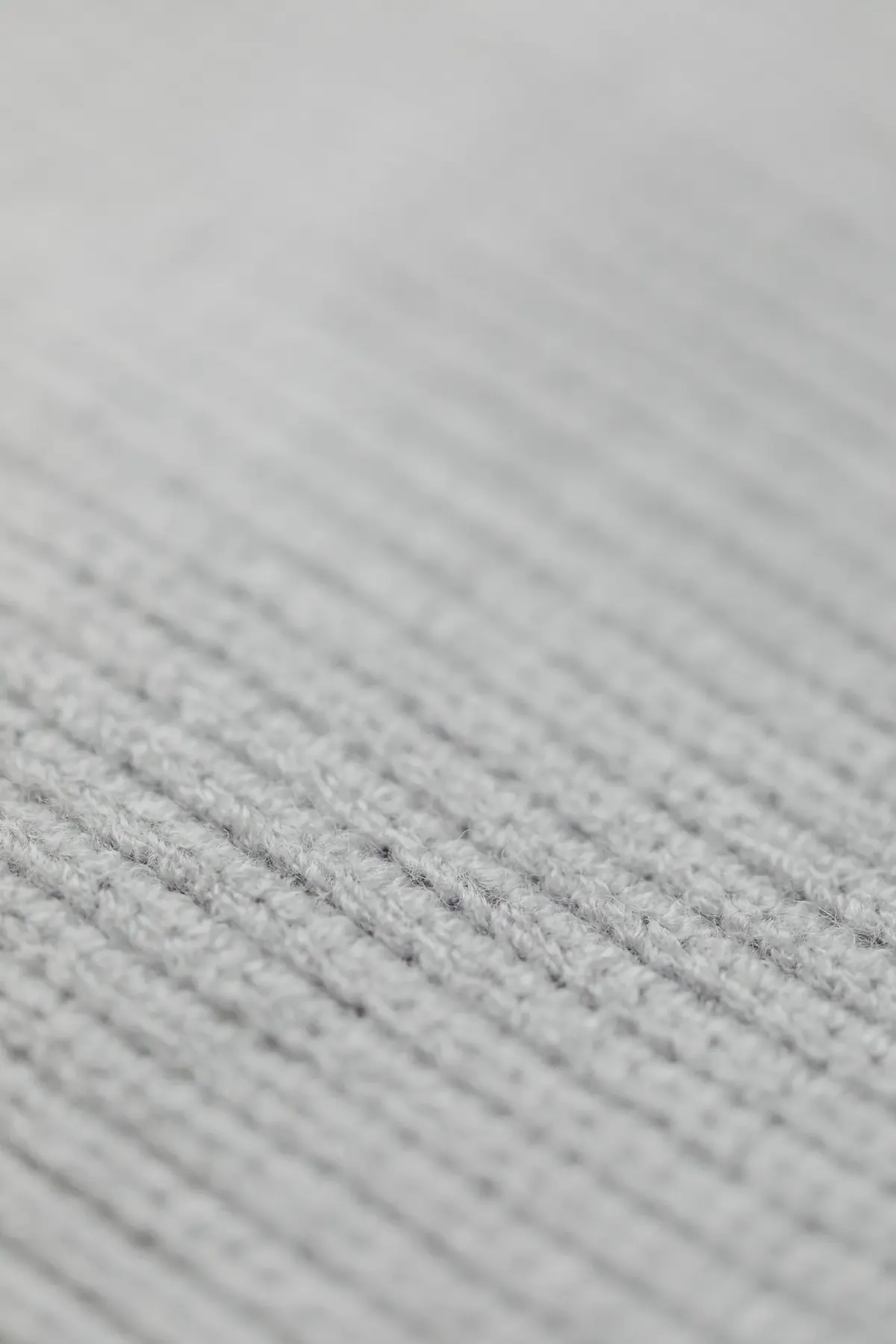 Close-up of soft gray knit fabric showing fine texture