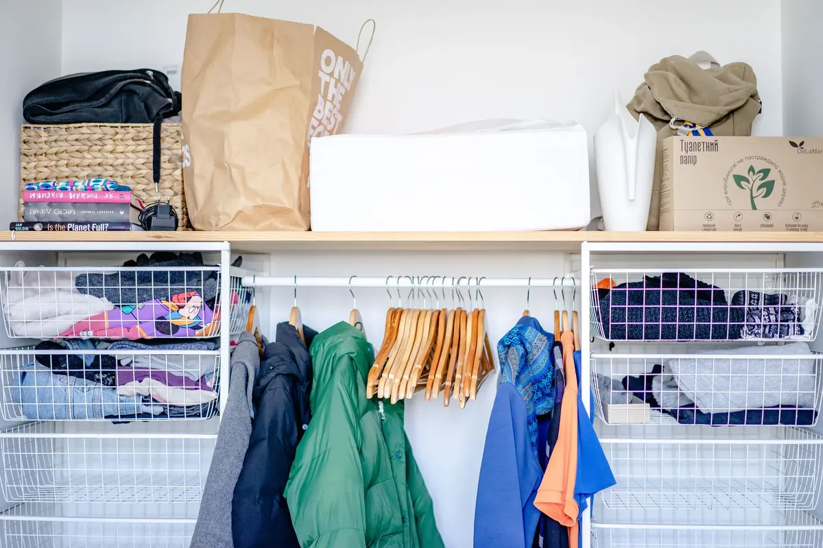 Organized wardrobe with hanging and folded clothing